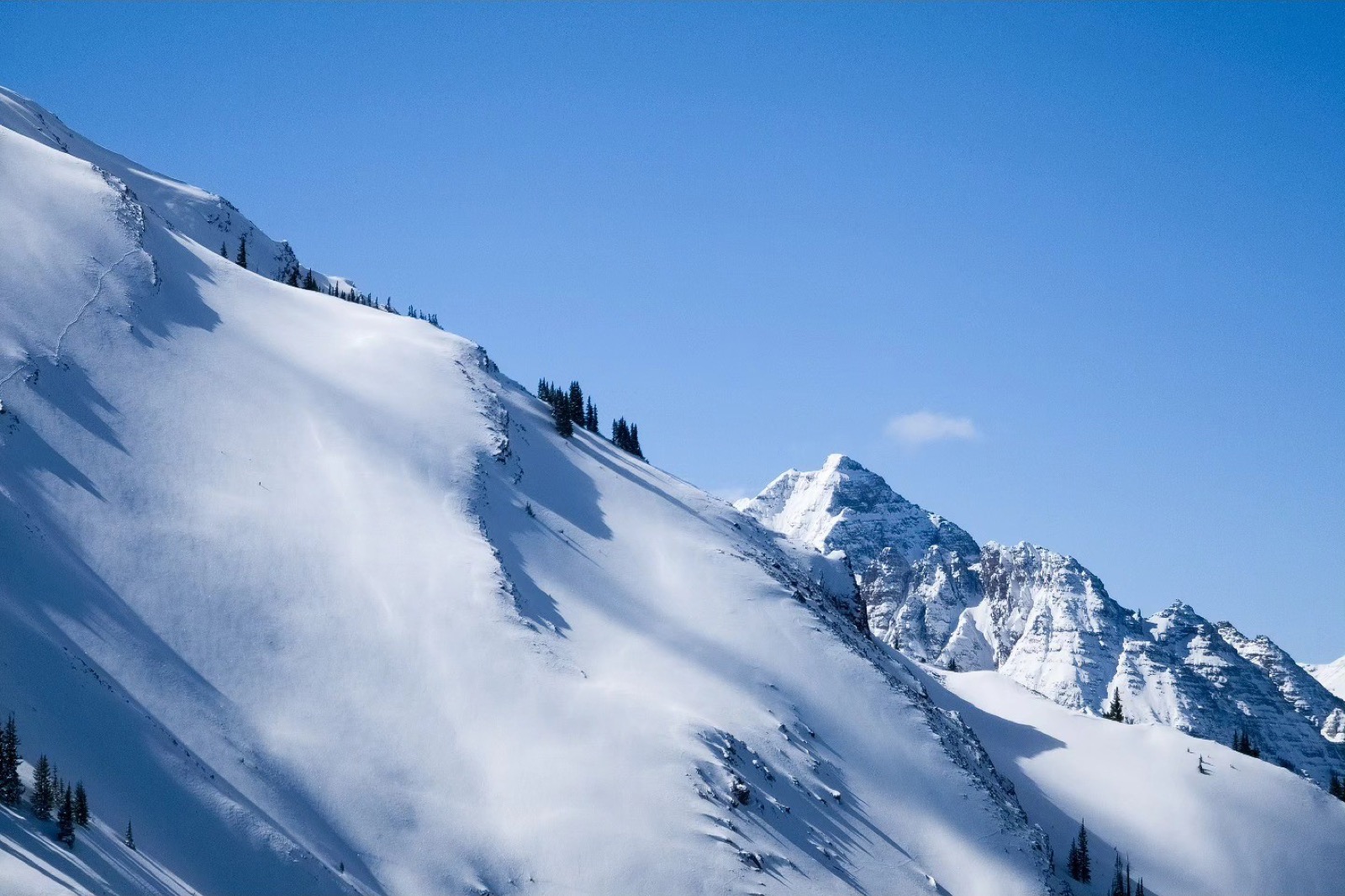 View from the chairlift over a snow covered valley